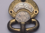 Fig. 6. Kölked-Feketekapu B, Hungary, grave no. B 85 (female burial). Belt buckle, gilded bronze decorated with niello. The figure at centre is presumably the Germanic god Tyr; according to A. Kiss, Das awarenzeitliche Gräberfeld in Kölked-Feketekapu B, Bu